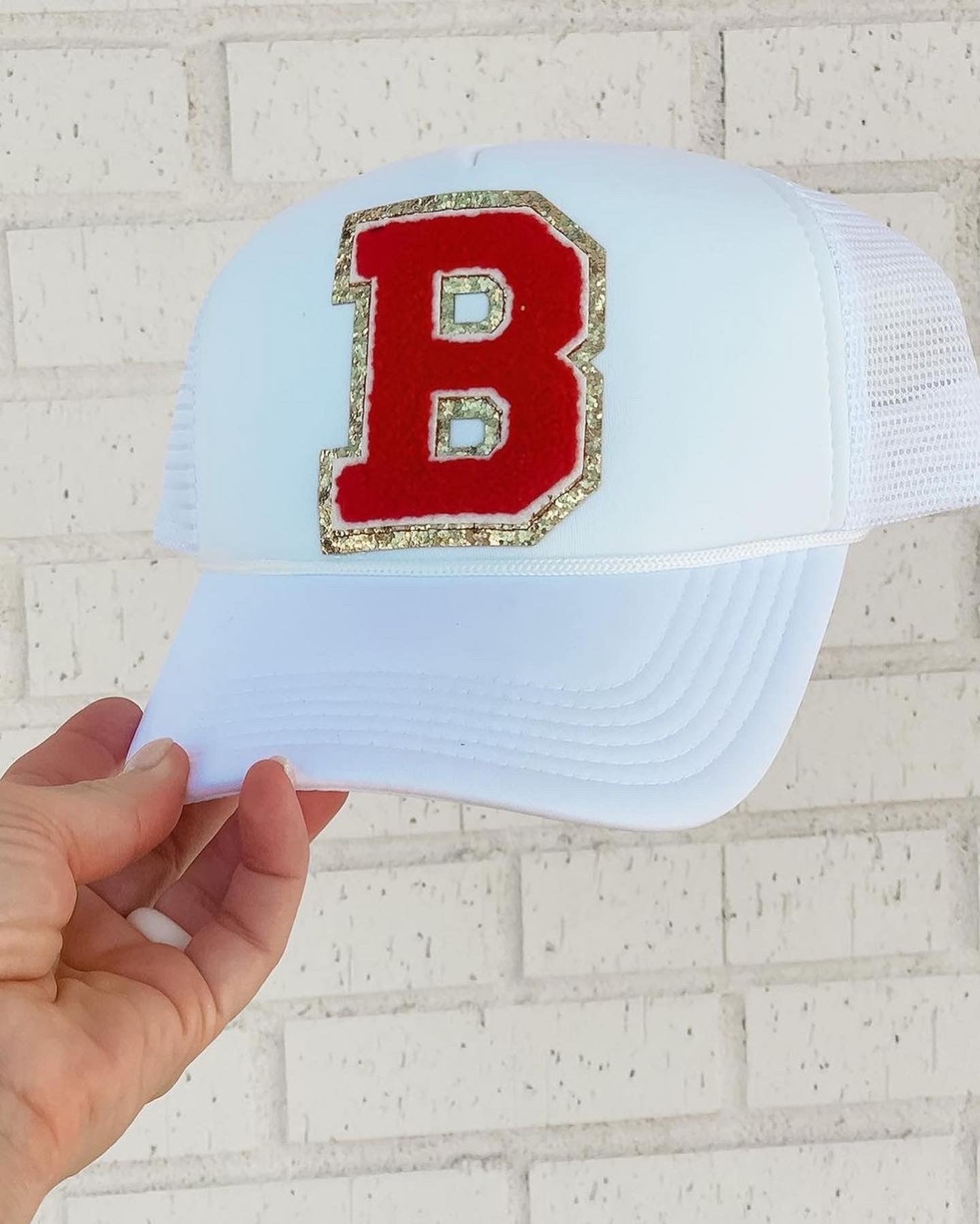 The Whitney White Bixby Trucker Hat